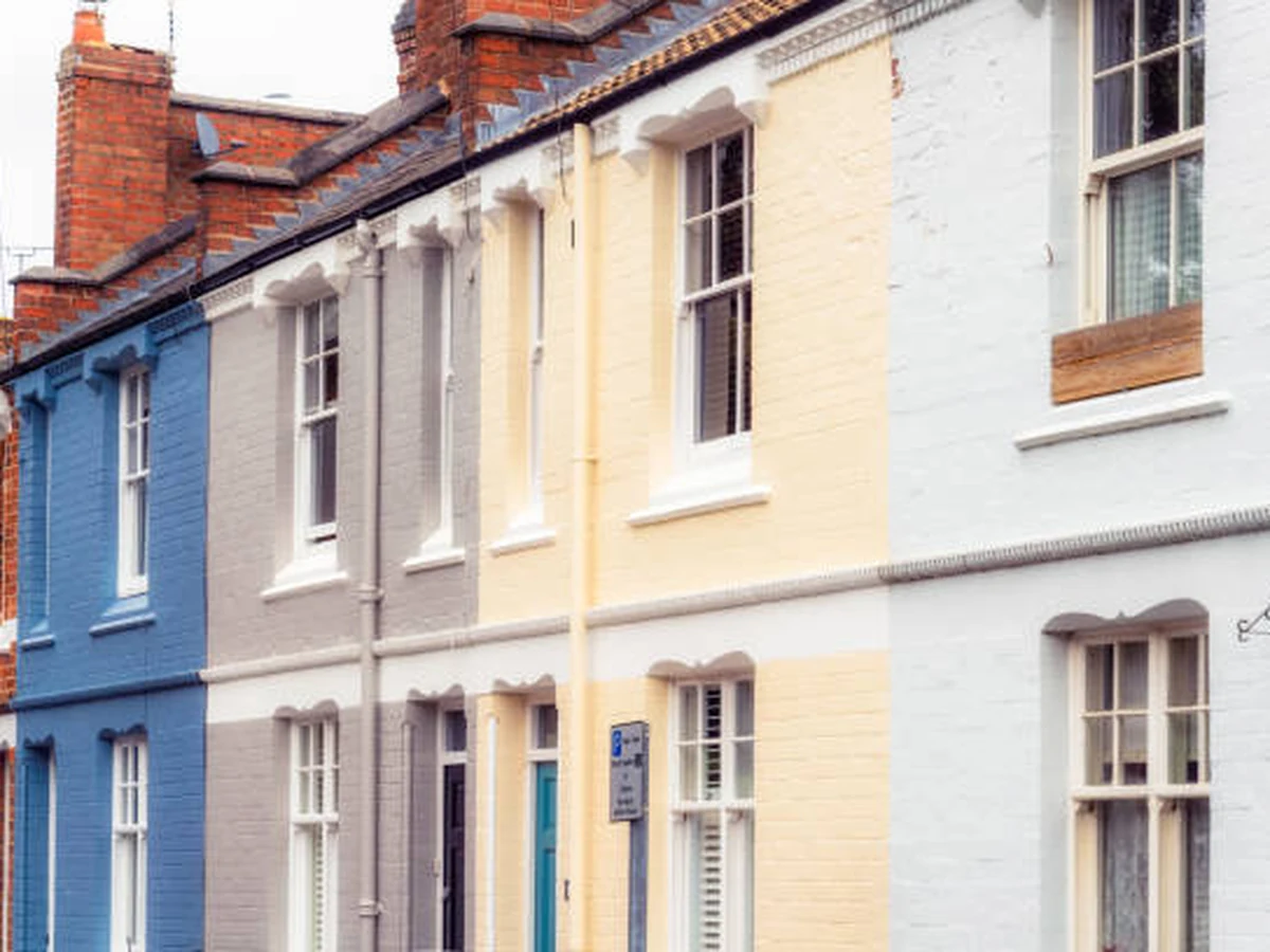 Exterior painting of Victorian terraced houses in Beaconsfield showing rendered facade work