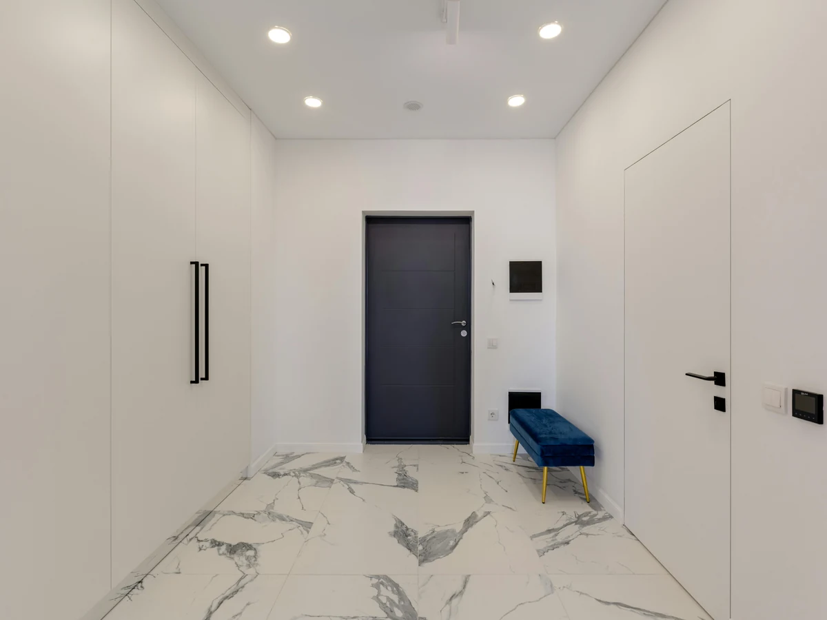 Hallway painting showing minimalist white hallway finish by Beaconsfield Decorators