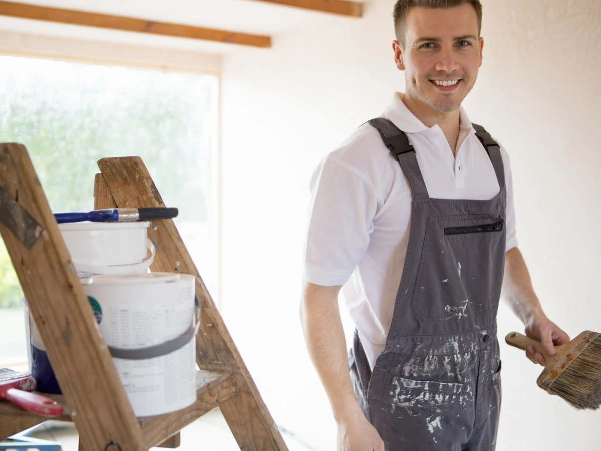 Professional house painter on ladder in Beaconsfield