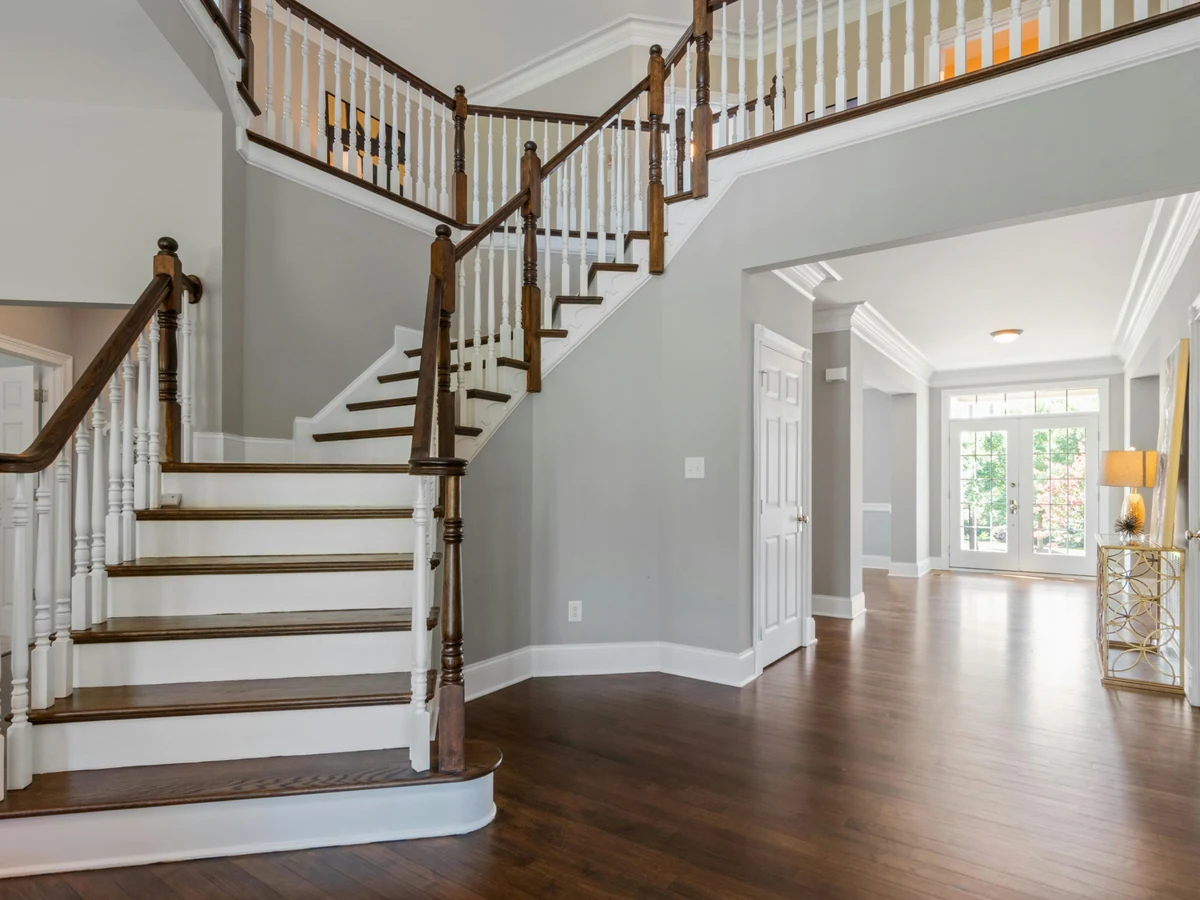 staircase-painting-grand-curved-staircase Grand curved staircase with painted handrails and balustrades by Beaconsfield Decorators