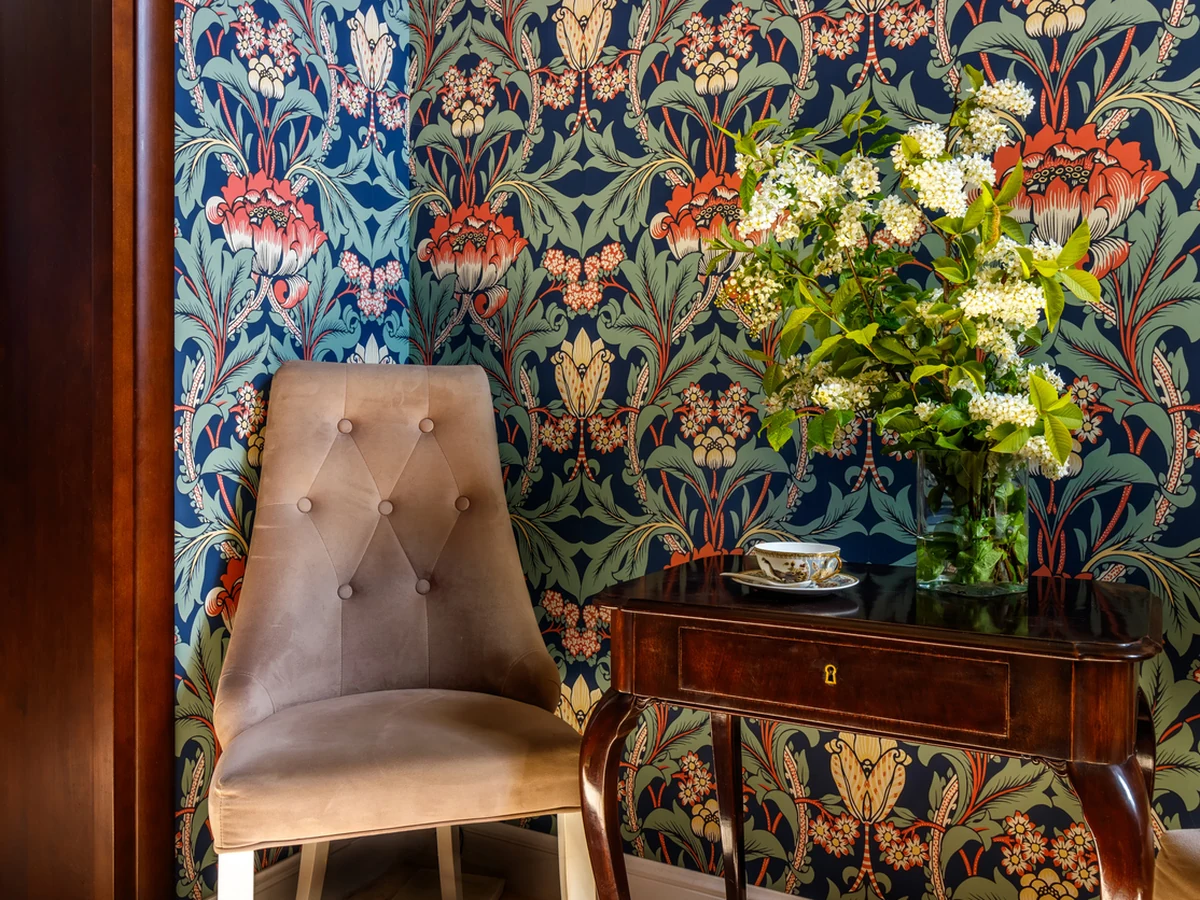 Bold floral wallpaper installation by Beaconsfield Decorators in period property hallway